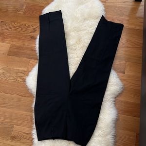Black high waisted split hem pants. NWOT.